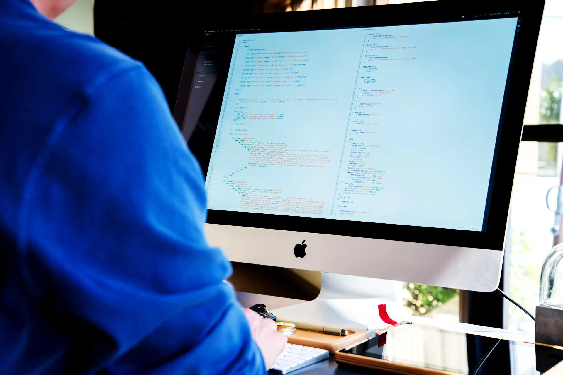 Developer working on code at a computer screen