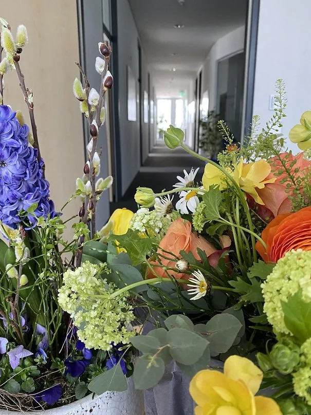 Flower bouquet in the corridor of the ask office