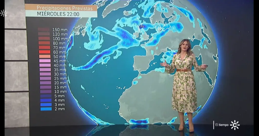 CanalSur weather presenter in front of a TriVis globe showing forecast precipitation