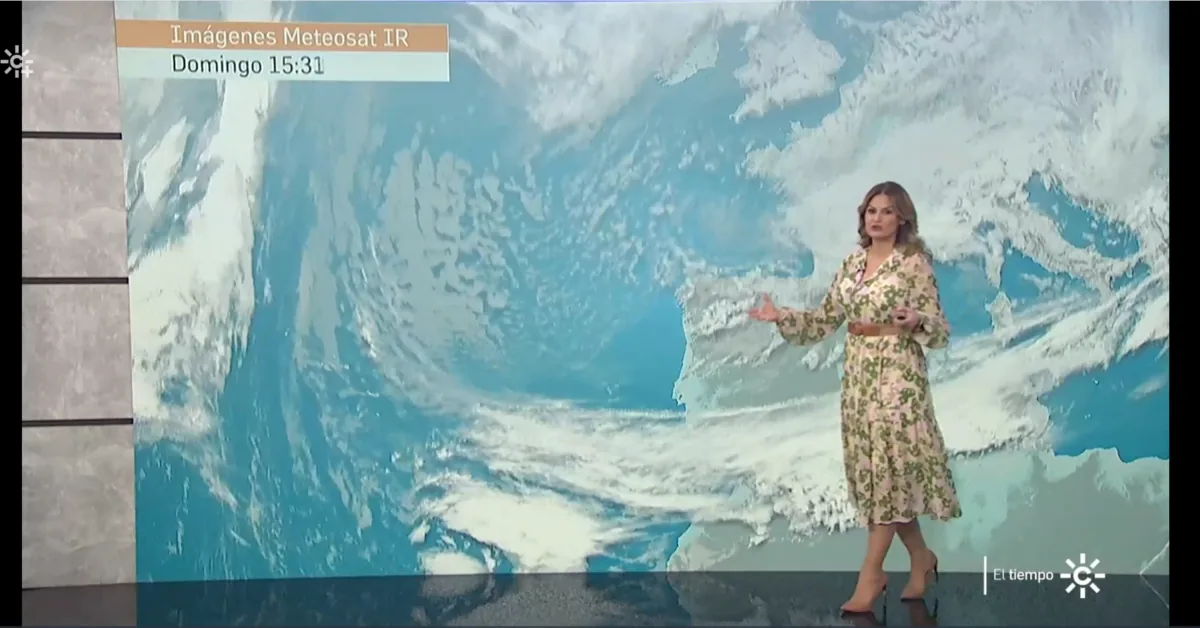 CanalSur weather presenter in front of an infrared satellite image